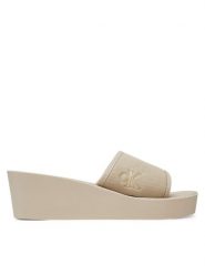 Calvin Klein Jeans Klapki Beach Wedge Slide Canvas YW0YW01725 Beżowy. Brązowe klapki damskie Calvin Klein Jeans, bez wzorów, z jeansu, bez obcasa. Za 139.99 zł.