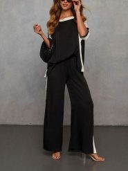 Milan Kiss Spodnie w kolorze czarnym rozmiar: L. Czarne spodnie materiałowe damskie Milan Kiss, bez wzorów, z materiału, z podwyższonym stanem. Za 152.99 zł.