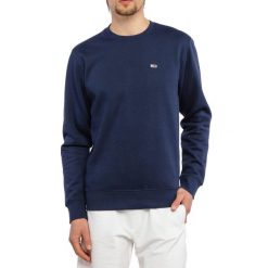 Bluza męska sportowa Tommy Hilfiger TJM REGULAR FLEECE. Niebieskie bluzy bez kaptura męskie Tommy Hilfiger, bez wzorów, sportowe, bez kołnierzyka, bez ramiączek. W wyprzedaży za 249.00 zł.