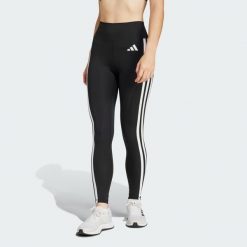 Legginsy Optimé Essentials 7/8 z 3 paskami. Białe legginsy damskie Adidas, bez wzorów, z materiału. Za 199.00 zł.