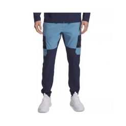 Spodnie dresowe Under Armour TECH UTILITY WOVEN. Niebieskie spodnie sportowe męskie Under Armour, z dresówki. Za 345.15 zł.