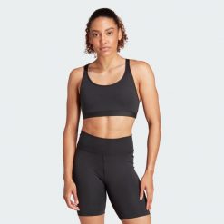 Biustonosz All Me Essentials Medium-Support. Czarne biustonosze sportowe damskie Adidas, bez wzorów, z materiału. Za 170.20 zł.