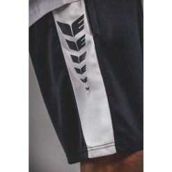 Erima Intro Spodenki Junior Czarny z nadrukiem skrzydeł. Białe szorty męskie 55PROTEC, bez wzorów, z materiału, sportowe. Za 217.99 zł.