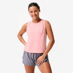 Koszulka bez rękawów damska Domyos Gym & Pilates Crop Top. Czerwone bluzki sportowe damskie DOMYOS, s, z bawełny, bez kołnierzyka, bez ramiączek. Za 39.99 zł.
