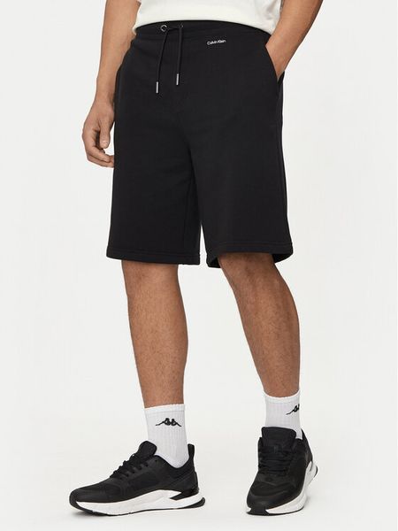 Calvin Klein Szorty sportowe Nano Logo K10K112689 Czarny Regular Fit. Czarne szorty męskie CALVIN KLEIN, bez wzorów, z bawełny, sportowe. Za 349.99 zł.