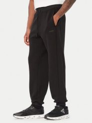 Guess Spodnie dresowe Z6BB03 K6544 Czarny Regular Fit. Czarne spodnie dresowe męskie Guess, z aplikacjami, z dresówki. Za 434.99 zł.