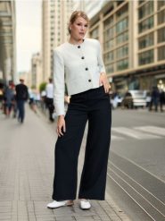 Spodnie wide leg - czarny. Czarne spodnie materiałowe damskie Sinsay, bez wzorów, z podwyższonym stanem. Za 59.99 zł.