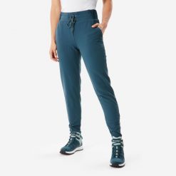 Spodnie turystyczne damskie Quechua NH500 Warm. Niebieskie spodnie materiałowe damskie QUECHUA, bez wzorów, z tkaniny, klasyczne. Za 169.99 zł.