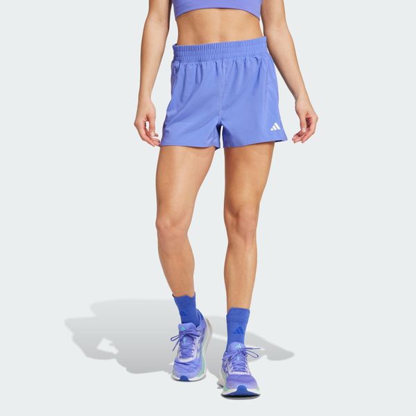 Szorty Own the Run. Niebieskie szorty damskie Adidas, bez wzorów, z materiału, klasyczne, z standardowym stanem. Za 189.50 zł.