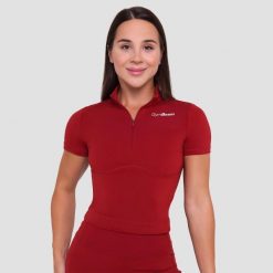 Koszulka damska fitness z zamkiem ciemnoczerwona Ignite Cropped. Czerwone bluzki sportowe damskie GYMBEAM, m, bez wzorów, z elastanu, bez ramiączek. Za 109.90 zł.