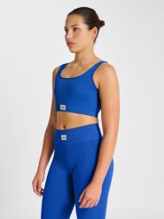 Bezszwowy biustonosz żebrowany dla kobiet Hummel Pulse. Niebieskie biustonosze sportowe damskie HUMMEL, bez wzorów, z materiału. Za 131.00 zł.