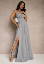 Szara Elegancka Sukienka o Rozkloszowanym Kroju z Rozcięciem na Ramiączkach z Kopertowym Dekoltem Winelia. Szare sukienki damskie Renee, l, bez wzorów, eleganckie, bez kołnierzyka, bez ramiączek, maxi, kopertowe. W wyprzedaży za 174.99 zł.