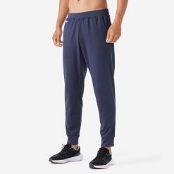 Spodnie do biegania męskie Kiprun Run 100 Warm ocieplane. Czarne spodnie materiałowe męskie KALENJI, bez wzorów, z materiału, sportowe. Za 99.99 zł.