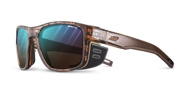 Okulary fotochromowe JULBO Shield M - Reactiv 2-4 - Brown/Matt Brown. Brązowe okulary przeciwsłoneczne męskie JULBO, z materiału. Za 699.00 zł.