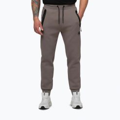 Spodnie męskie Pitbull Dogwood Track. Brązowe spodnie materiałowe męskie PITBULL, bez wzorów, z bawełny, sportowe. Za 249.99 zł.