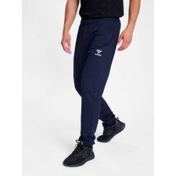 Spodnie do biegania Hummel Go 2.0. Niebieskie spodnie materiałowe męskie HUMMEL, bez wzorów, z bawełny, sportowe. Za 193.50 zł.