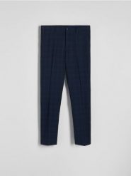 Spodnie garniturowe slim fit - granatowy. Niebieskie spodnie wizytowe męskie Reserved, z tkaniny. W wyprzedaży za 129.99 zł.