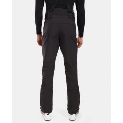 Spodnie narciarskie Kilpi Rhea. Czarne spodnie materiałowe męskie Kilpi, bez wzorów, sportowe. Za 473.69 zł.