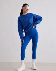 Damskie legginsy biegowe 7/8 wysoki stan, squat proof, kieszenie Le Run lazurowe. Niebieskie legginsy damskie Aim'n, s, bez wzorów, z elastanu. Za 387.00 zł.