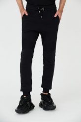 BALMAIN Czarne spodnie dresowe RIbbed Flock Sweatpants. Czarne spodnie dresowe męskie Balmain, bez wzorów, z dresówki. W wyprzedaży za 2,199.99 zł.