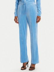 Juicy Couture Spodnie dresowe Tina JCAPW045 Niebieski Regular Fit. Niebieskie spodnie dresowe damskie Juicy Couture, xs, bez wzorów, z dresówki. Za 399.99 zł.