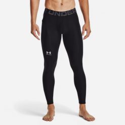 Legginsy męskie Under Armour HeatGear®. Czarne spodnie sportowe męskie Under Armour, z materiału. Za 129.99 zł.