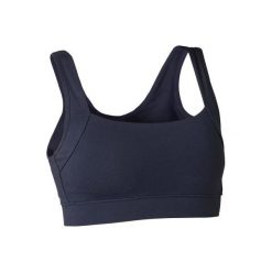 Stanik Gym & Pilates granatowy. Niebieskie biustonosze sportowe damskie DOMYOS, bez wzorów, z bawełny. Za 34.99 zł.