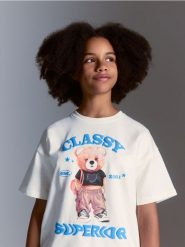 Bawełniany t-shirt z nadrukiem - złamana biel. Koszulki dziewczęce Reserved, bez wzorów, z bawełny, bez ramiączek. Za 39.99 zł.