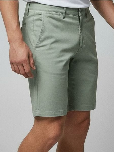 Szorty chino - zielony. Zielone szorty męskie Sinsay, bez wzorów, z materiału. Za 39.99 zł.