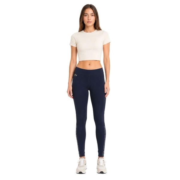 Spodnie damskie Lacoste sportowe treningowe legginsy granatowe. Niebieskie legginsy damskie Lacoste, uniwersalny, bez wzorów, z elastanu. Za 357.00 zł.