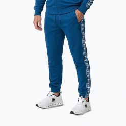 Spodnie męskie Pitbull Track Powers. Niebieskie spodnie materiałowe męskie PITBULL, bez wzorów, z elastanu, sportowe. Za 229.99 zł.