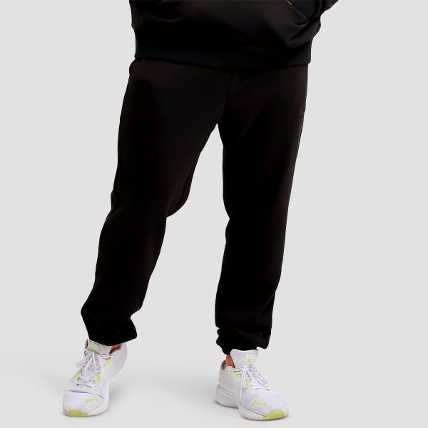 Spodnie męskie fitness regular Unity. Czarne spodnie sportowe męskie GYMBEAM, z bawełny. Za 118.90 zł.