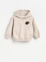 Bawełniana bluza z aplikacją - beżowy. Brązowe bluzy i bluzki niemowlęce Reserved, z aplikacjami, z bawełny, bez ramiączek, bez kaptura. Za 59.99 zł.