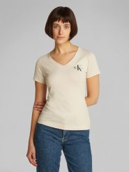 CALVIN KLEIN JEANS Koszulka w kolorze kremowym rozmiar: XS. Brązowe bluzki damskie Calvin Klein Jeans, xs, bez wzorów, z bawełny, bez kołnierzyka, bez ramiączek. Za 109.78 zł.