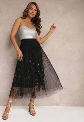 Czarna Rozkloszowana Plisowana Spódnica z Tiulu Wykończona z Przodu Cyrkoniami i Gumką w Talii Missarla. Czarne spódniczki damskie Renee, l, z aplikacjami, z satyny, eleganckie, midi, dopasowane. Za 44.99 zł.