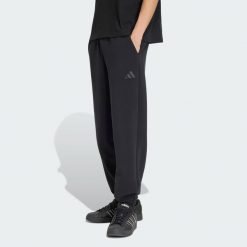 Spodnie Soft Lux. Czarne spodnie materiałowe męskie Adidas, bez wzorów, z bawełny, eleganckie, z standardowym stanem. Za 329.00 zł.