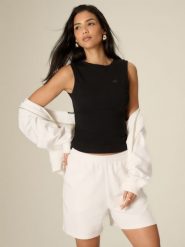 4F Top slim z prążkowanej dzianiny damski - czarny M. Czarne topy damskie 4f, m, bez wzorów, z bawełny, bez kołnierzyka. Za 59.99 zł.