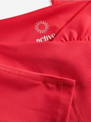 Spodnie flare - czerwony. Czerwone spodnie materiałowe damskie Reserved, bez wzorów, z dzianiny. Za 129.99 zł.