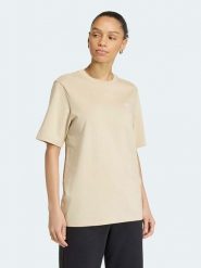 Adidas Koszulka w kolorze beżowym rozmiar: M. Brązowe bluzki damskie Adidas, m, bez wzorów, bez kołnierzyka, bez ramiączek. Za 86.95 zł.