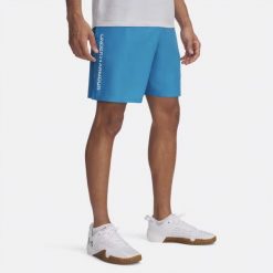 Spodenki na trening do ćwiczeń męskie UNDER ARMOUR szybkoschnące. Niebieskie szorty męskie Under Armour, bez kołnierzyka. Za 129.00 zł.
