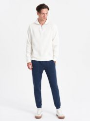 Spodnie męskie dresowe CARROT ze strukturalnej dzianiny - ciemnoniebieskie V5 OM-PASK-0143 - XXL. Niebieskie spodnie dresowe męskie Ombre Clothing, bez wzorów, z bawełny. W wyprzedaży za 69.99 zł.