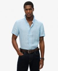 Superdry Koszula Vacation Linen krótki rękaw 100% len Sea Blue Chambray. Niebieskie koszule damskie Superdry., na lato, s, bez wzorów, ze lnu, bez kołnierzyka, bez ramiączek. Za 322.70 zł.