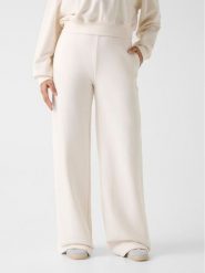 Guess Spodnie materiałowe 180561 Biały Slim Fit. Białe spodnie materiałowe damskie Guess, z aplikacjami, z materiału. Za 295.00 zł.