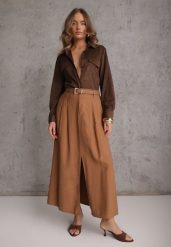 Brązowa Rozkloszowana Spódnica z Wiskozy Zdobiona Rozcięciem i Paskiem Urilia. Brązowe spódniczki damskie Renee, l, z aplikacjami, z koronki, eleganckie, maxi, rozkloszowane. Za 119.99 zł.