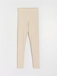 Prążkowane legginsy z gumką w pasie - kremowy. Białe legginsy damskie Sinsay, l, bez wzorów, prążkowane. Za 29.99 zł.