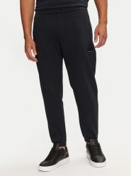 Armani Exchange Spodnie dresowe 6DZPJA ZJNKZ 1510 Granatowy Regular Fit. Niebieskie spodnie dresowe męskie Armani Exchange, bez wzorów, z bawełny. Za 379.99 zł.
