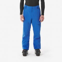 Spodnie narciarskie i snowboardowe męskie Quechua 500. Niebieskie spodnie materiałowe męskie WED'ZE, bez wzorów, z materiału, sportowe. Za 279.99 zł.