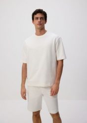 Bawełniany t-shirt boxy - złamana biel. T-shirty męskie Reserved, l, bez wzorów, z bawełny, bez kołnierzyka. W wyprzedaży za 55.99 zł.