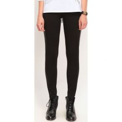 LEGGINSY DAMSKIE MATOWE GŁADKIE. Czarne legginsy damskie TROLL, s, bez wzorów, z dzianiny. W wyprzedaży za 29.99 zł.