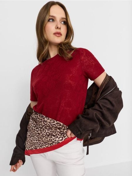 Koszulka z krótkim rękawem i motywem kwiatowym - pomarańczowy. Brązowe t-shirty damskie Sinsay, l, bez wzorów, bez kołnierzyka. Za 29.99 zł.